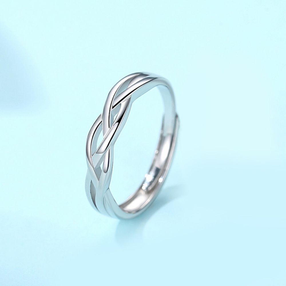 Picture of 925 silver couple rings with green silk entwined